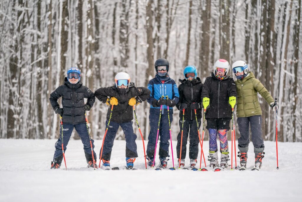 HoliMont ski racer carving through slalom gates in Ellicottville, NY